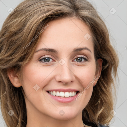 Joyful white young-adult female with long  brown hair and green eyes