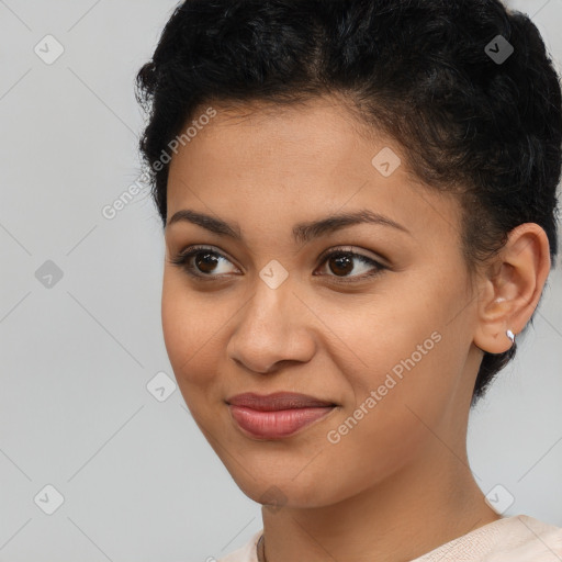 Joyful latino young-adult female with short  brown hair and brown eyes