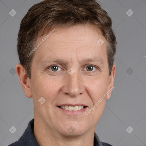 Joyful white adult male with short  brown hair and brown eyes