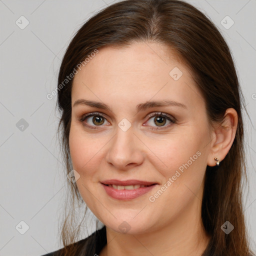 Joyful white young-adult female with long  brown hair and brown eyes