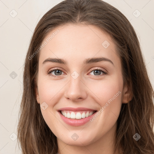 Joyful white young-adult female with long  brown hair and green eyes