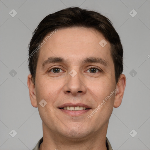 Joyful white adult male with short  brown hair and grey eyes