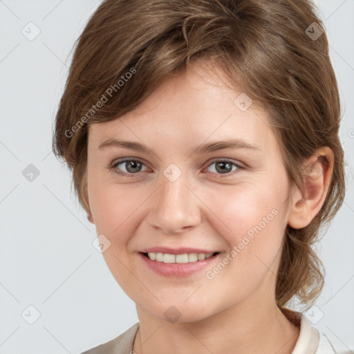 Joyful white young-adult female with medium  brown hair and grey eyes