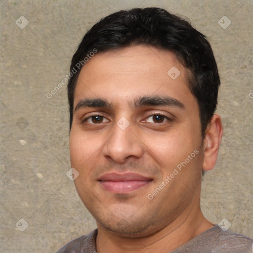 Joyful white young-adult male with short  black hair and brown eyes