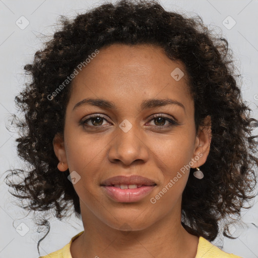 Joyful black young-adult female with medium  brown hair and brown eyes