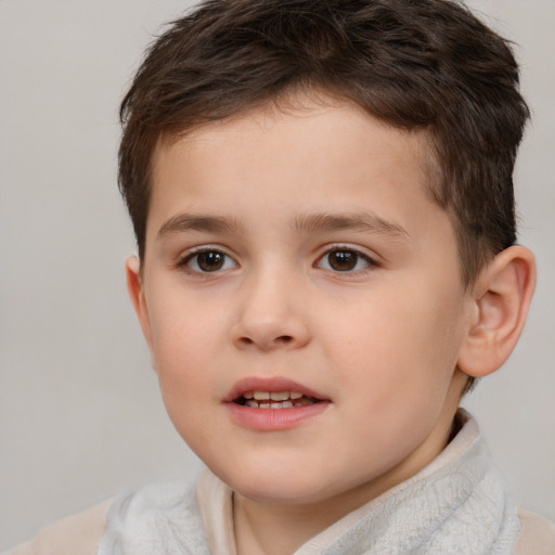 Joyful white child male with short  brown hair and brown eyes