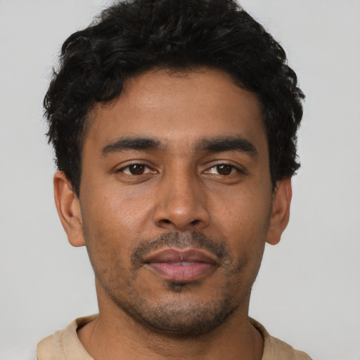 Neutral latino young-adult male with short  brown hair and brown eyes