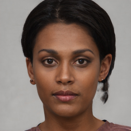 Neutral black young-adult female with short  black hair and brown eyes