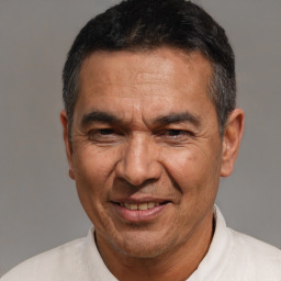Joyful white adult male with short  black hair and brown eyes