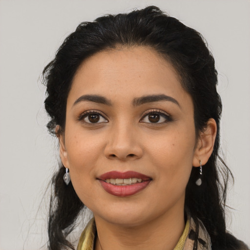 Joyful latino young-adult female with medium  black hair and brown eyes
