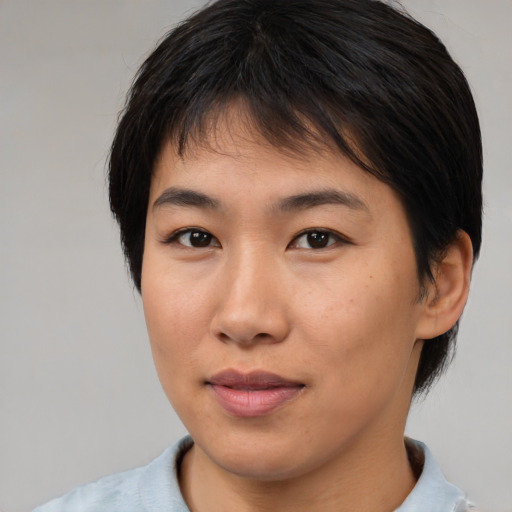 Neutral asian young-adult female with medium  brown hair and brown eyes