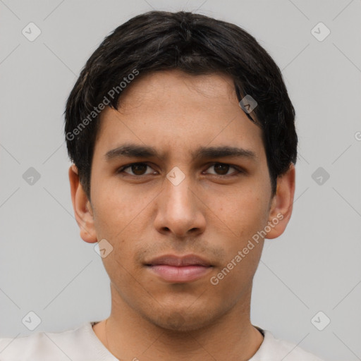 Neutral latino young-adult male with short  black hair and brown eyes