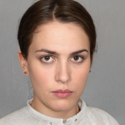 Neutral white young-adult female with short  brown hair and brown eyes