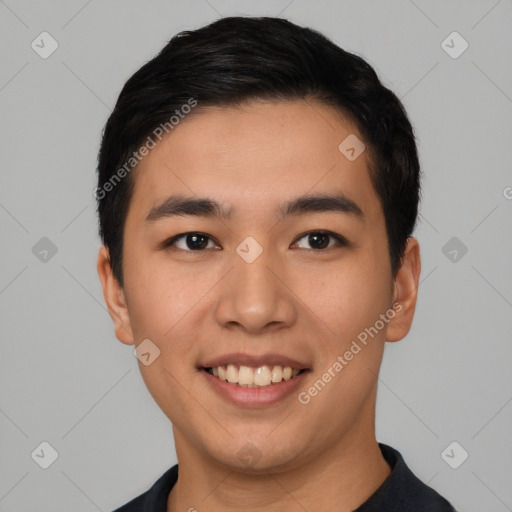 Joyful asian young-adult male with short  black hair and brown eyes