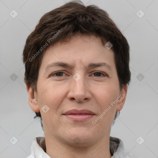 Joyful white adult female with short  brown hair and brown eyes