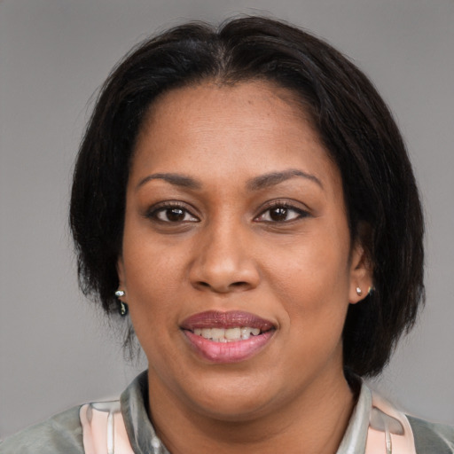 Joyful latino young-adult female with medium  brown hair and brown eyes