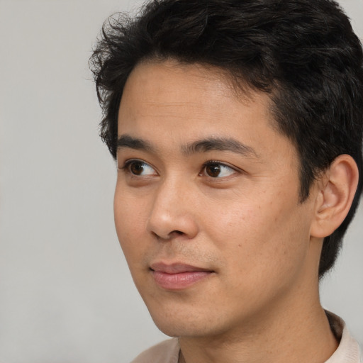 Neutral white young-adult male with short  black hair and brown eyes