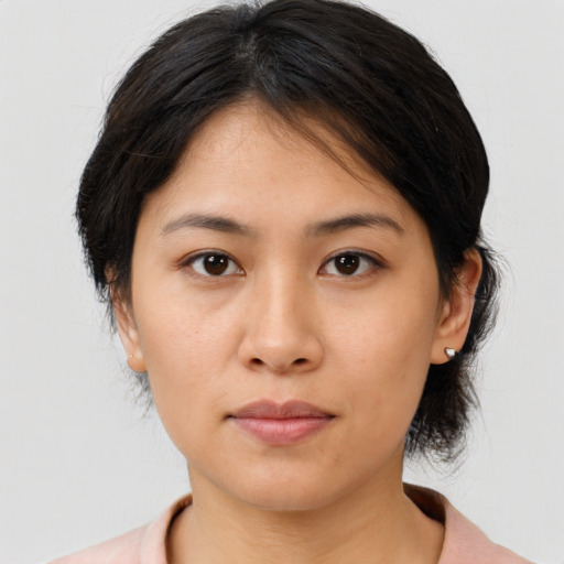 Neutral asian young-adult female with medium  brown hair and brown eyes