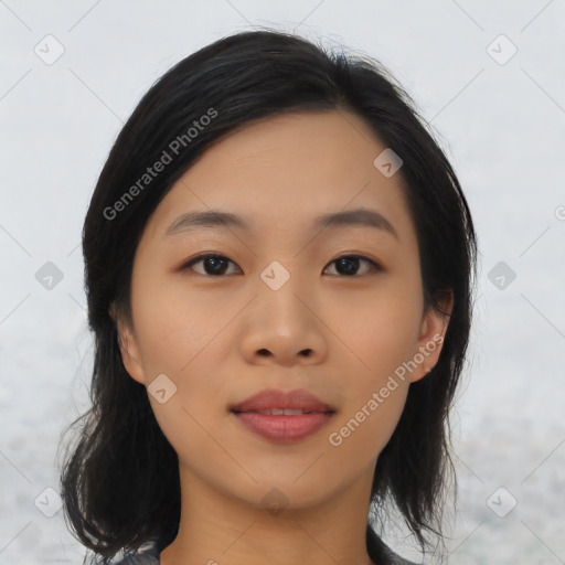 Joyful asian young-adult female with medium  black hair and brown eyes