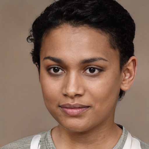 Joyful latino young-adult female with short  black hair and brown eyes