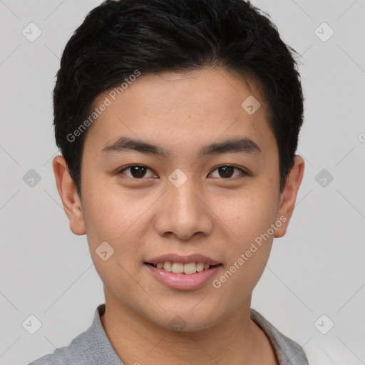 Joyful asian young-adult male with short  brown hair and brown eyes