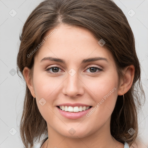 Joyful white young-adult female with medium  brown hair and grey eyes