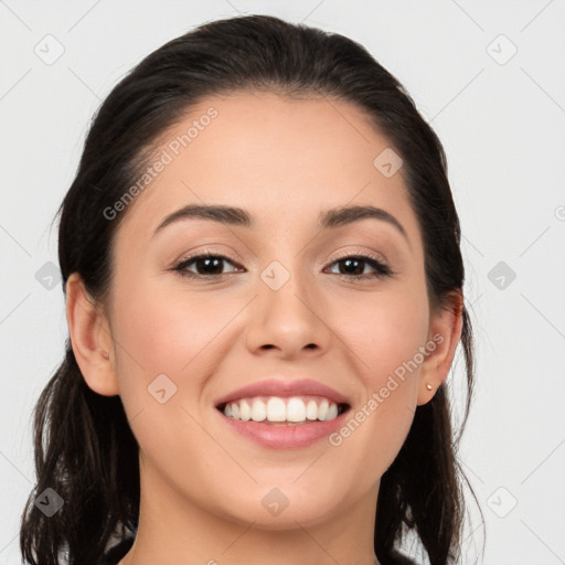 Joyful white young-adult female with long  black hair and brown eyes