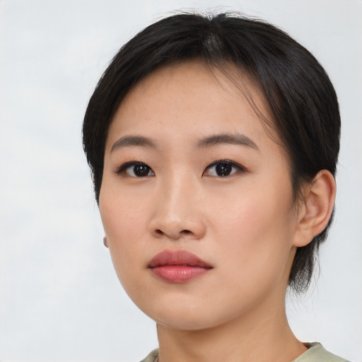 Neutral asian young-adult female with medium  brown hair and brown eyes