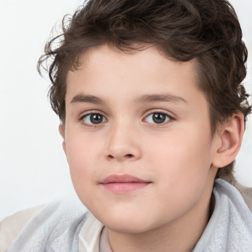 Joyful white child male with short  brown hair and brown eyes