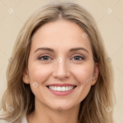 Joyful white young-adult female with long  brown hair and green eyes