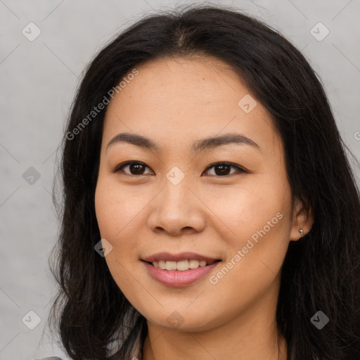 Joyful asian young-adult female with long  brown hair and brown eyes