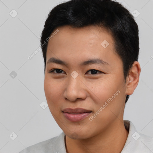 Joyful asian young-adult male with short  black hair and brown eyes