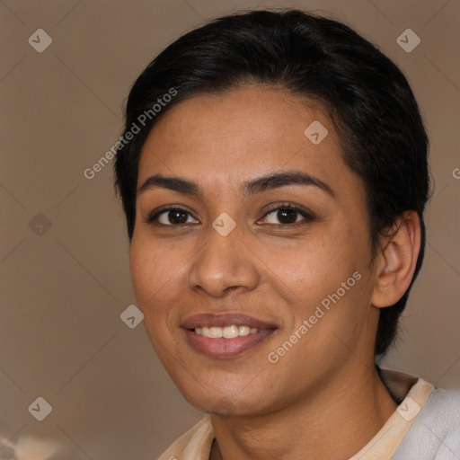 Joyful latino young-adult female with medium  brown hair and brown eyes