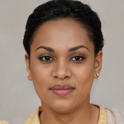 Joyful black young-adult female with short  brown hair and brown eyes