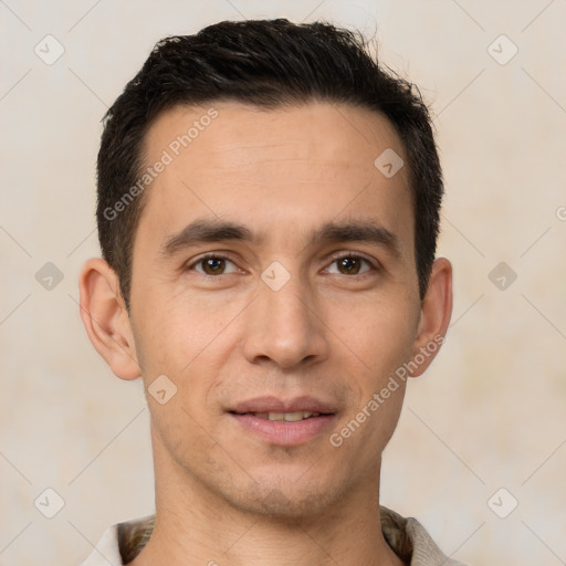 Joyful white young-adult male with short  black hair and brown eyes