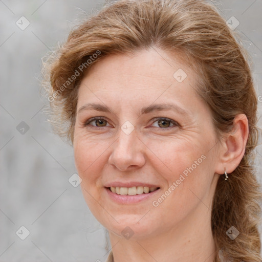 Joyful white adult female with long  brown hair and brown eyes