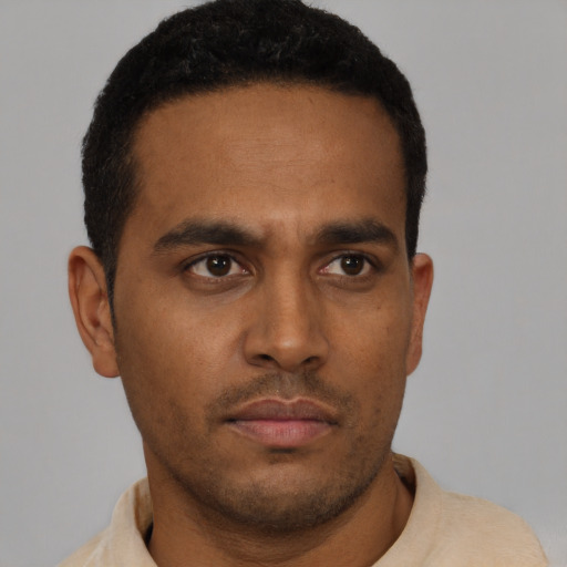 Neutral latino young-adult male with short  brown hair and brown eyes