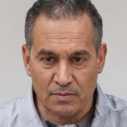 Joyful white middle-aged male with short  brown hair and brown eyes