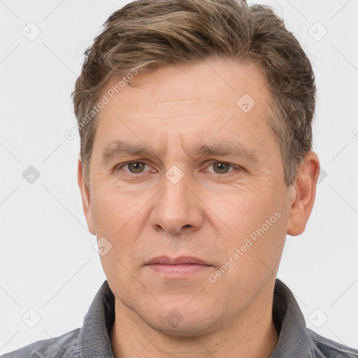 Joyful white adult male with short  brown hair and grey eyes