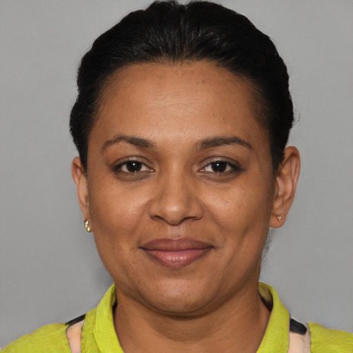 Joyful black adult female with short  brown hair and brown eyes