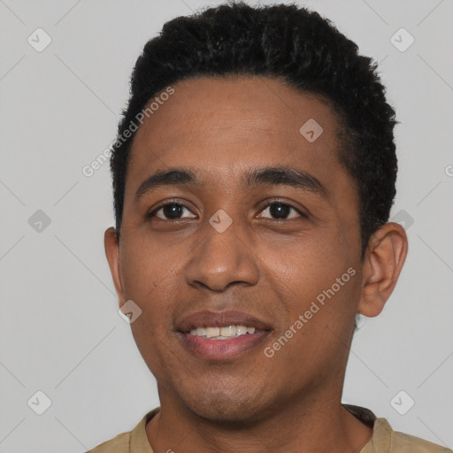 Joyful black young-adult male with short  black hair and brown eyes