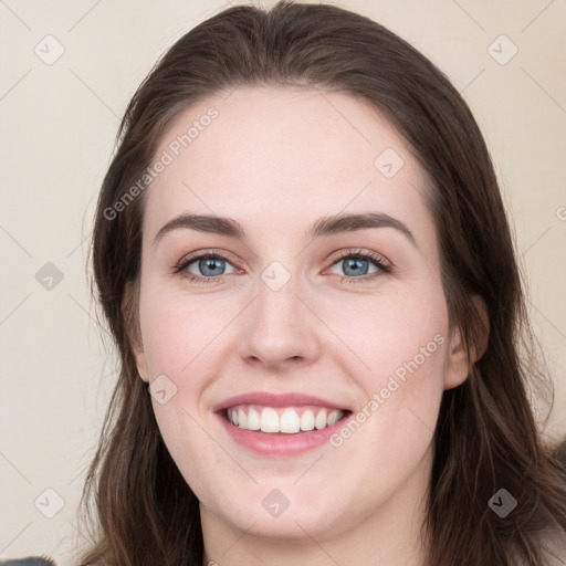 Joyful white young-adult female with long  brown hair and green eyes