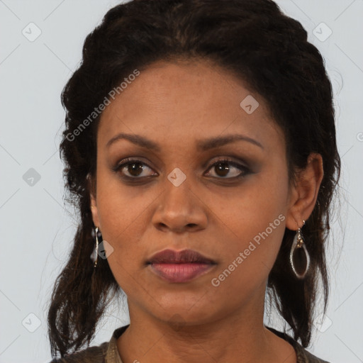 Joyful black adult female with medium  brown hair and brown eyes