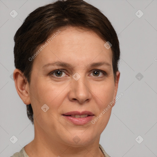 Joyful white adult female with short  brown hair and grey eyes