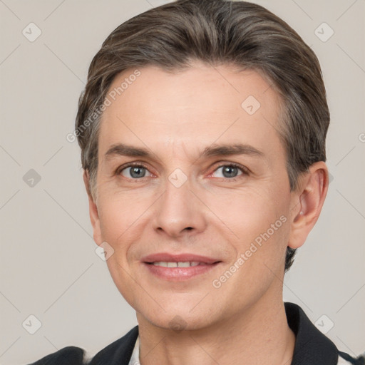 Joyful white adult male with short  brown hair and grey eyes