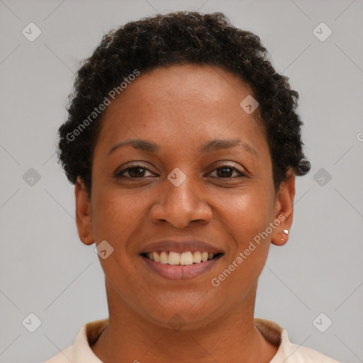 Joyful black young-adult female with short  brown hair and brown eyes