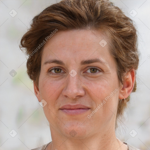 Joyful white adult female with short  brown hair and grey eyes