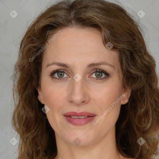 Joyful white adult female with medium  brown hair and green eyes