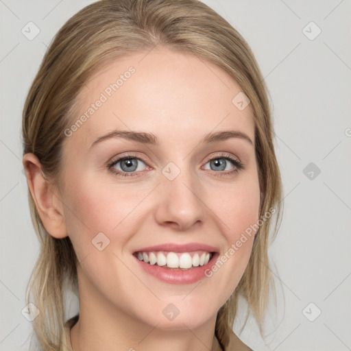 Joyful white young-adult female with medium  brown hair and blue eyes