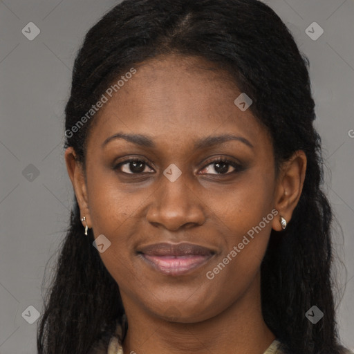 Joyful black young-adult female with long  brown hair and brown eyes